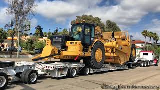 Hauling a brand new CAT 657 scraper from dealership to jobsite [upl. by Lan]